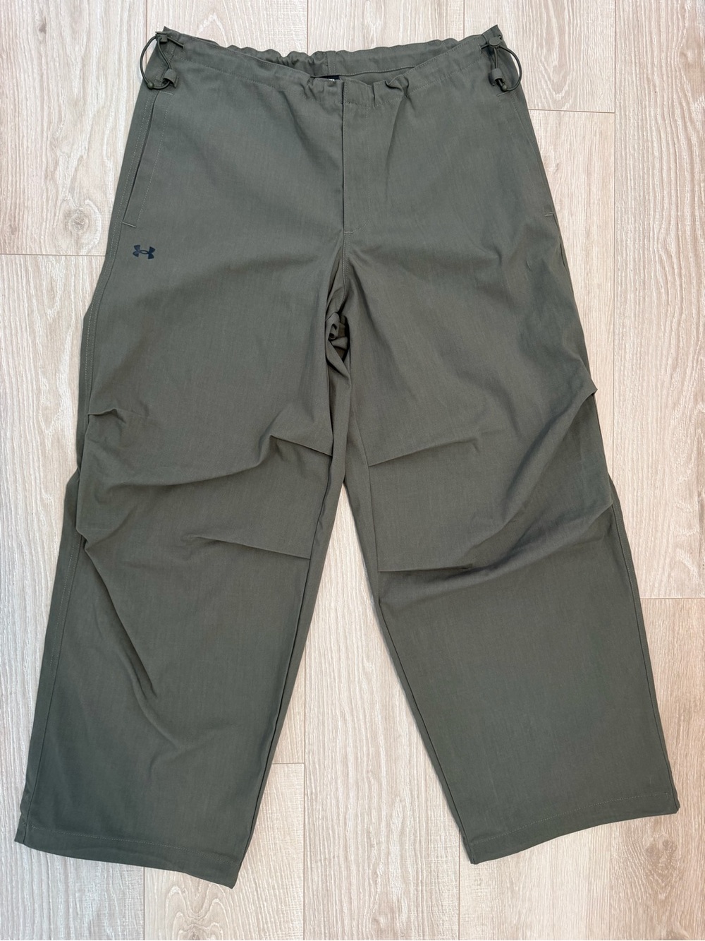 Under Armour women's Unstoppable cargo pants in a green color